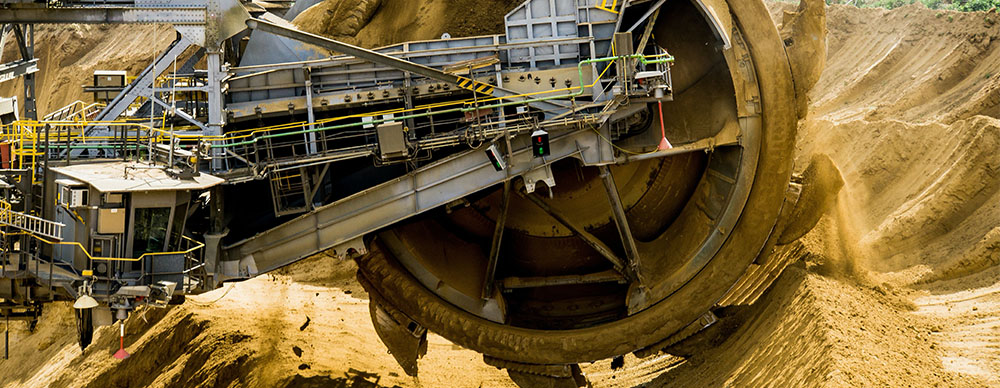 Industrial mining equipment being used on a mining operations site