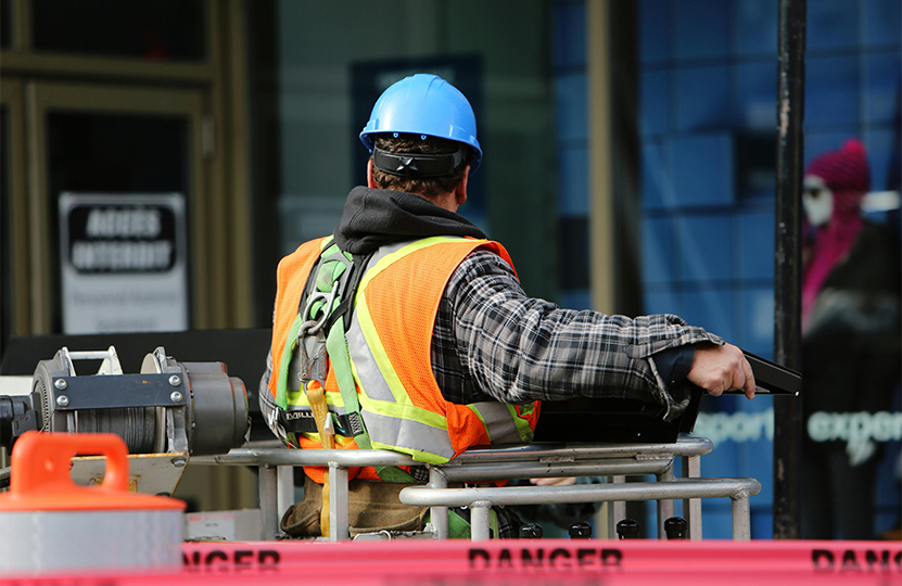 A worker prepares to use a lift to perform a work task